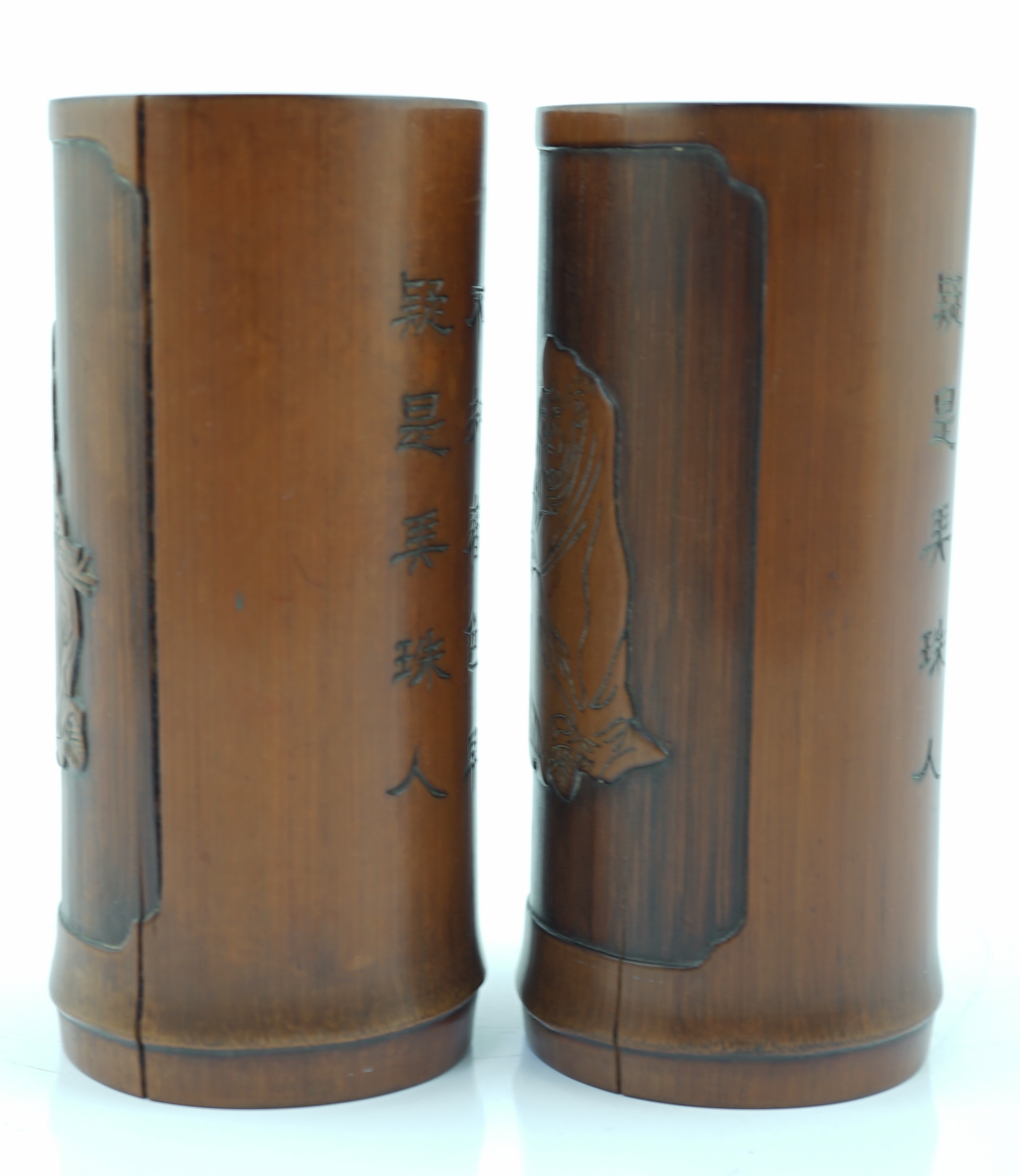 A pair of Chinese inscribed 'Damo' bamboo brushpots, 19th century, age cracks